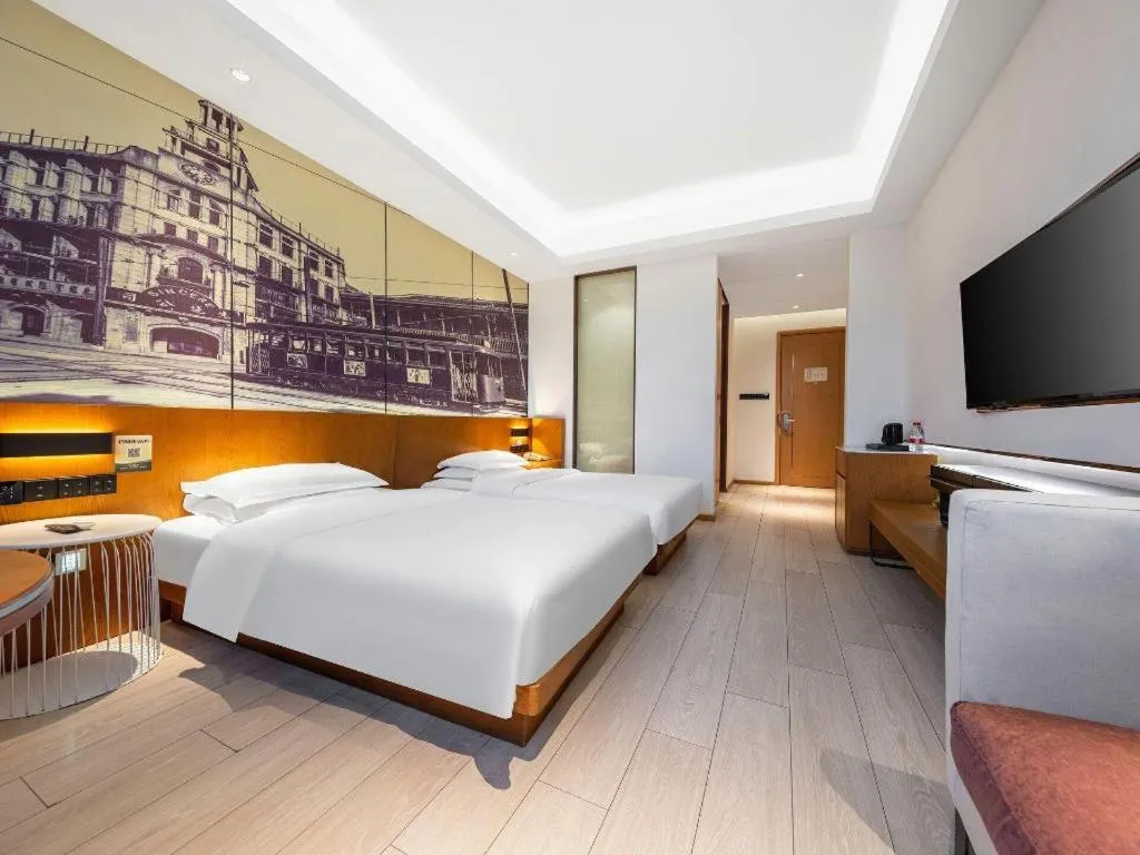 Bed in Jinjiang Metropolo Hotel Shanghai Hongqiao International Exhibition Center Branch