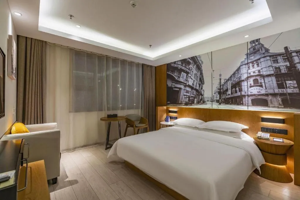 Bed in Jinjiang Metropolo Hotel Shanghai Hongqiao International Exhibition Center Branch