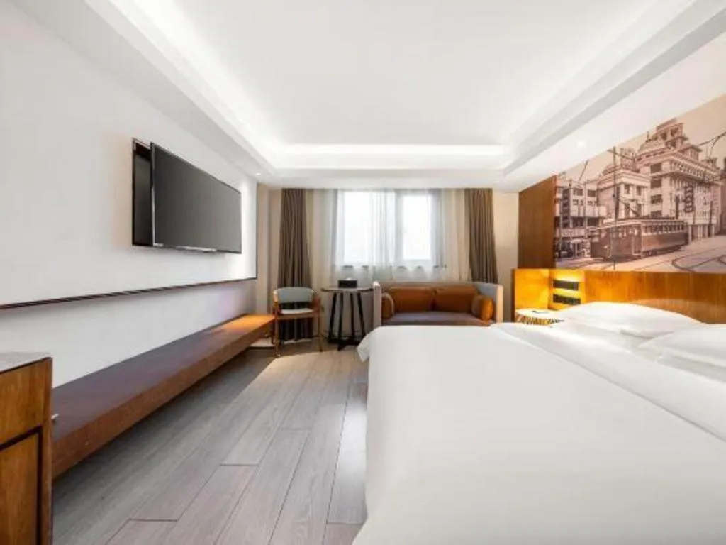 Bed in Jinjiang Metropolo Hotel Shanghai Hongqiao International Exhibition Center Branch