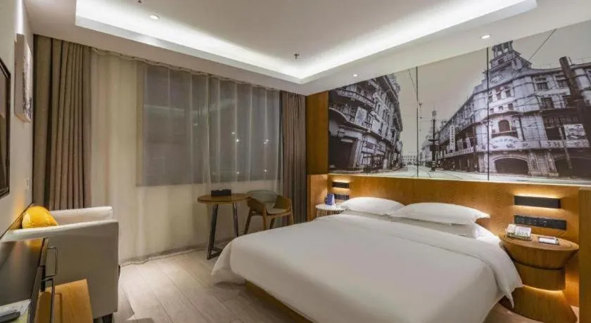 Bed in Jinjiang Metropolo Hotel Shanghai Hongqiao International Exhibition Center Branch