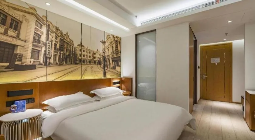 Bed in Jinjiang Metropolo Hotel Shanghai Hongqiao International Exhibition Center Branch