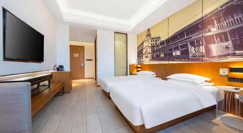 Bed in Jinjiang Metropolo Hotel Shanghai Hongqiao International Exhibition Center Branch