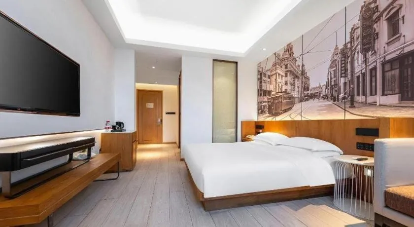 Bed in Jinjiang Metropolo Hotel Shanghai Hongqiao International Exhibition Center Branch