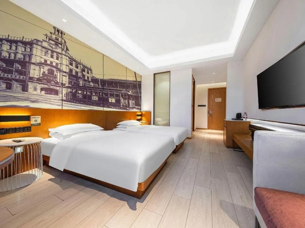 Bed in Jinjiang Metropolo Hotel Shanghai Hongqiao International Exhibition Center Branch