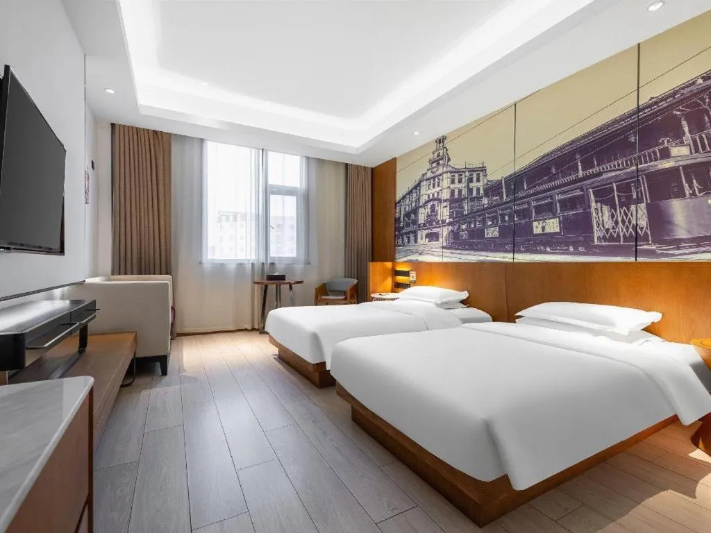 Bed in Jinjiang Metropolo Hotel Shanghai Hongqiao International Exhibition Center Branch