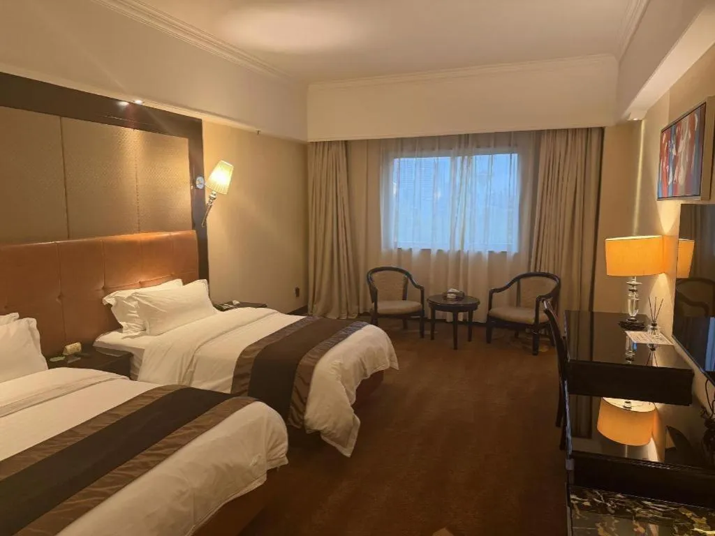 Bed in The Bmc Hotel