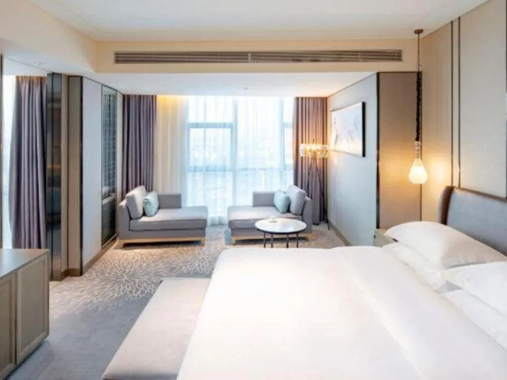 Bed in ZHONG DING HOTEL