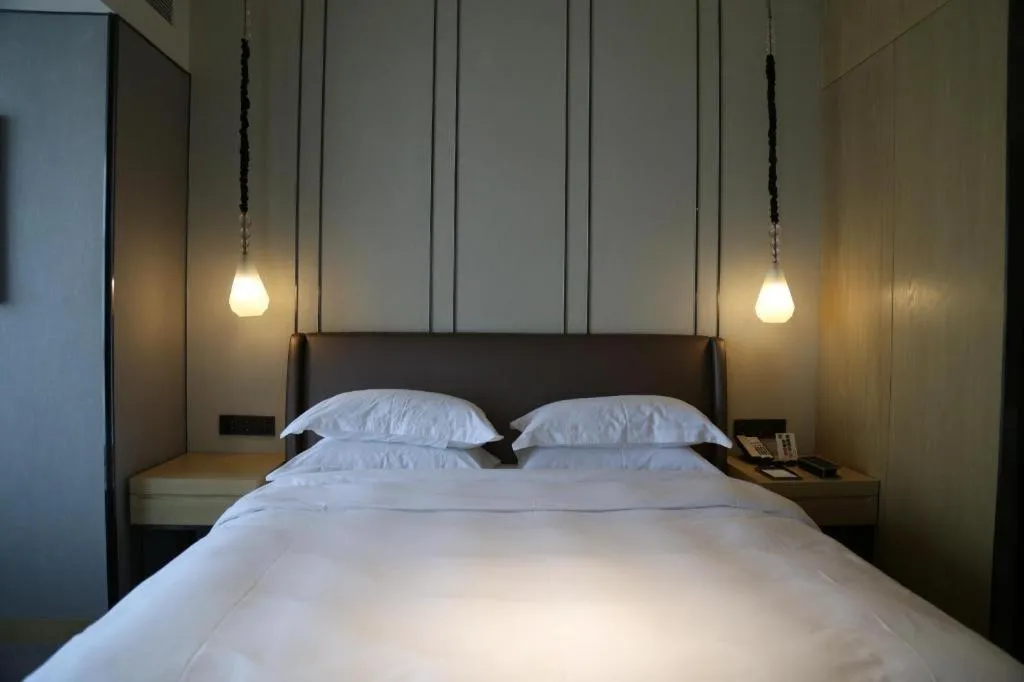 Bed in ZHONG DING HOTEL