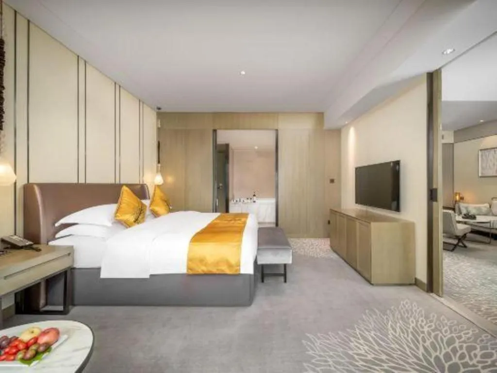 Bed in ZHONG DING HOTEL