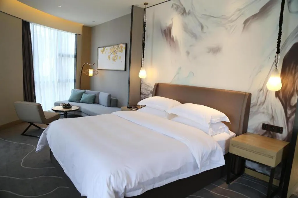 Bed in ZHONG DING HOTEL