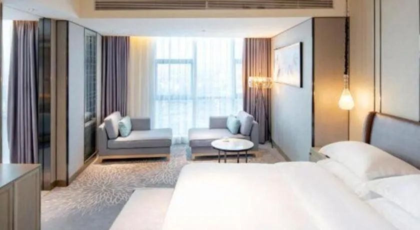 Bed in ZHONG DING HOTEL