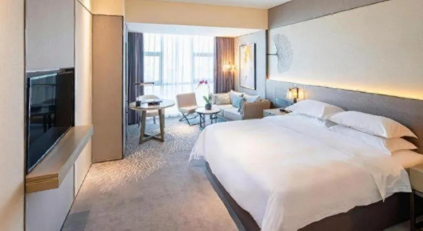 Bed in ZHONG DING HOTEL