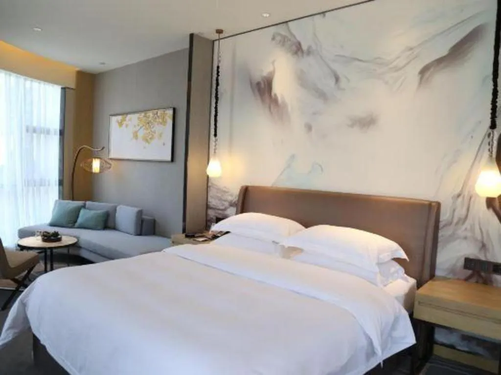 Bed in ZHONG DING HOTEL