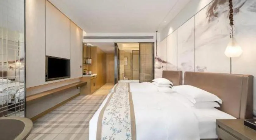 Bed in ZHONG DING HOTEL