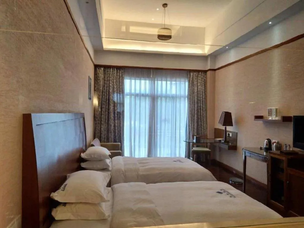 Bed in Shaoguan Palace International Resorts