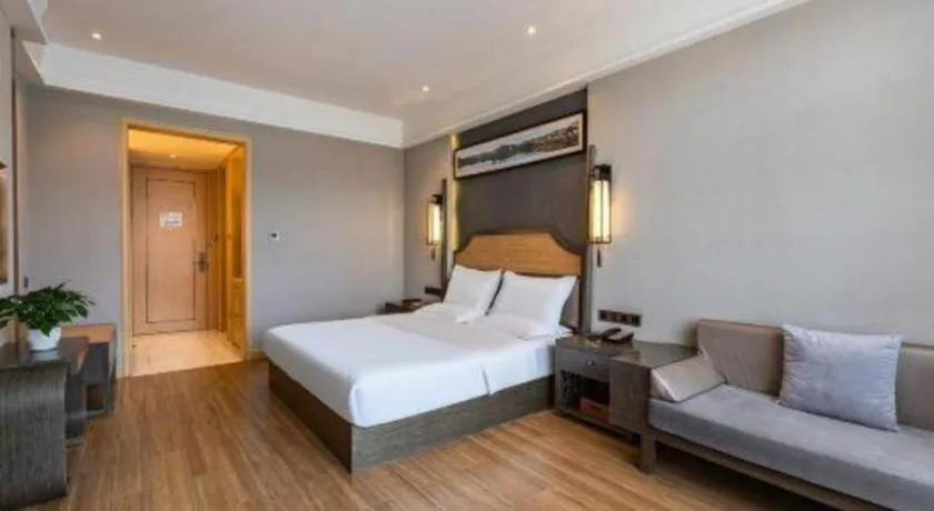 Bed in Metropolo Hotel YunNan Shangri-la Karma Dan Songzanlin Temple