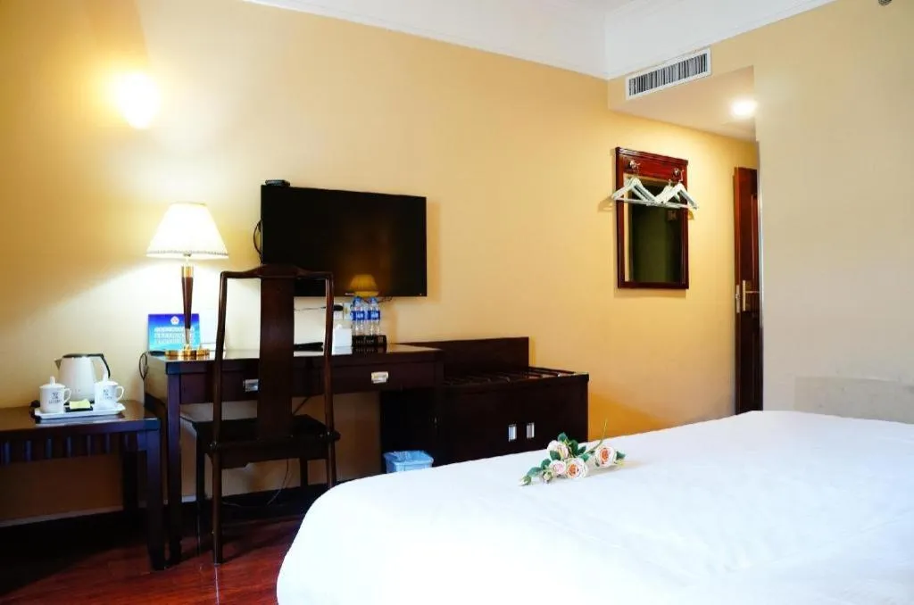 Bed in Hujialou Hot Spring Hotel