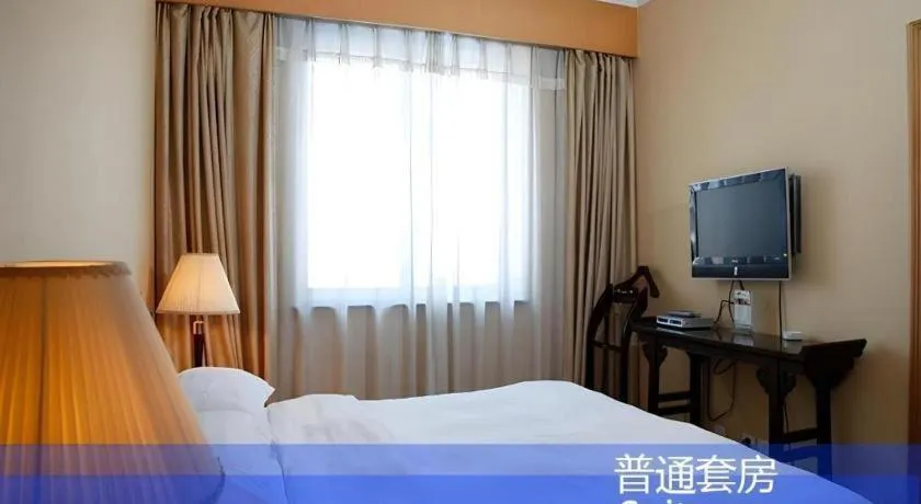 Bed in Hujialou Hot Spring Hotel