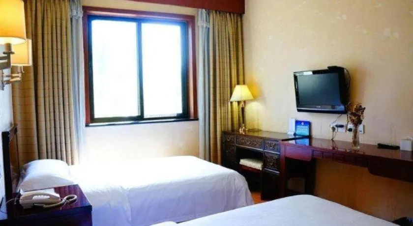 Bed in Hujialou Hot Spring Hotel