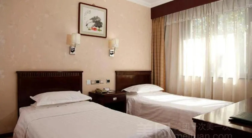 Bed in Hujialou Hot Spring Hotel