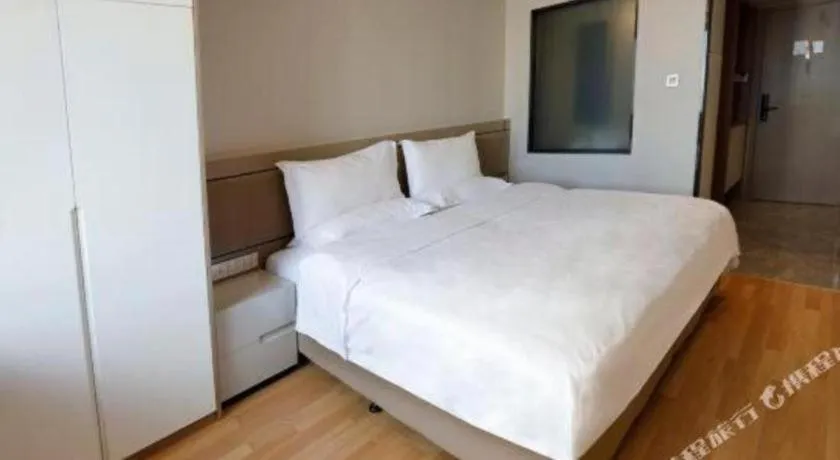 Bed in Hujialou Hot Spring Hotel