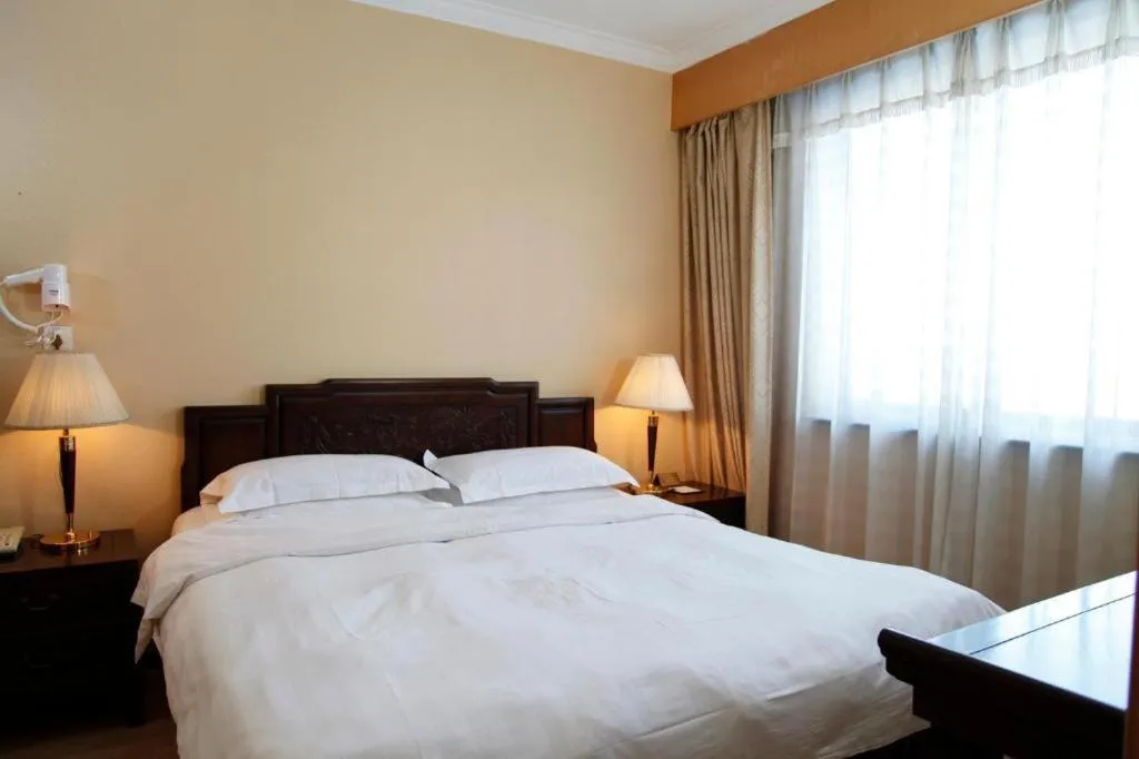 Bed in Hujialou Hot Spring Hotel