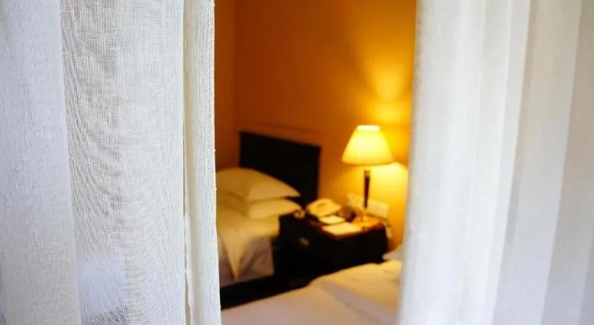 Bed in Hujialou Hot Spring Hotel