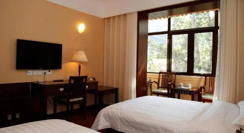 Bed in Hujialou Hot Spring Hotel