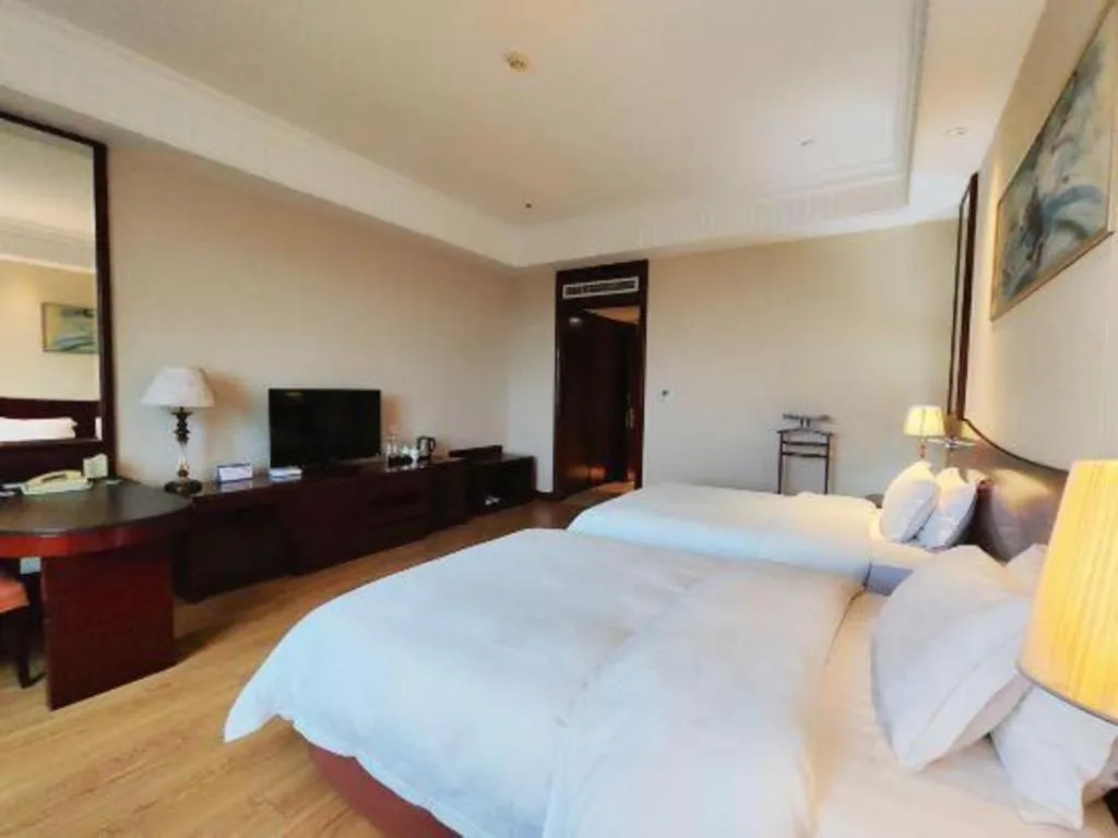 Bed in Longqi Jianguo Hotel Kunshan