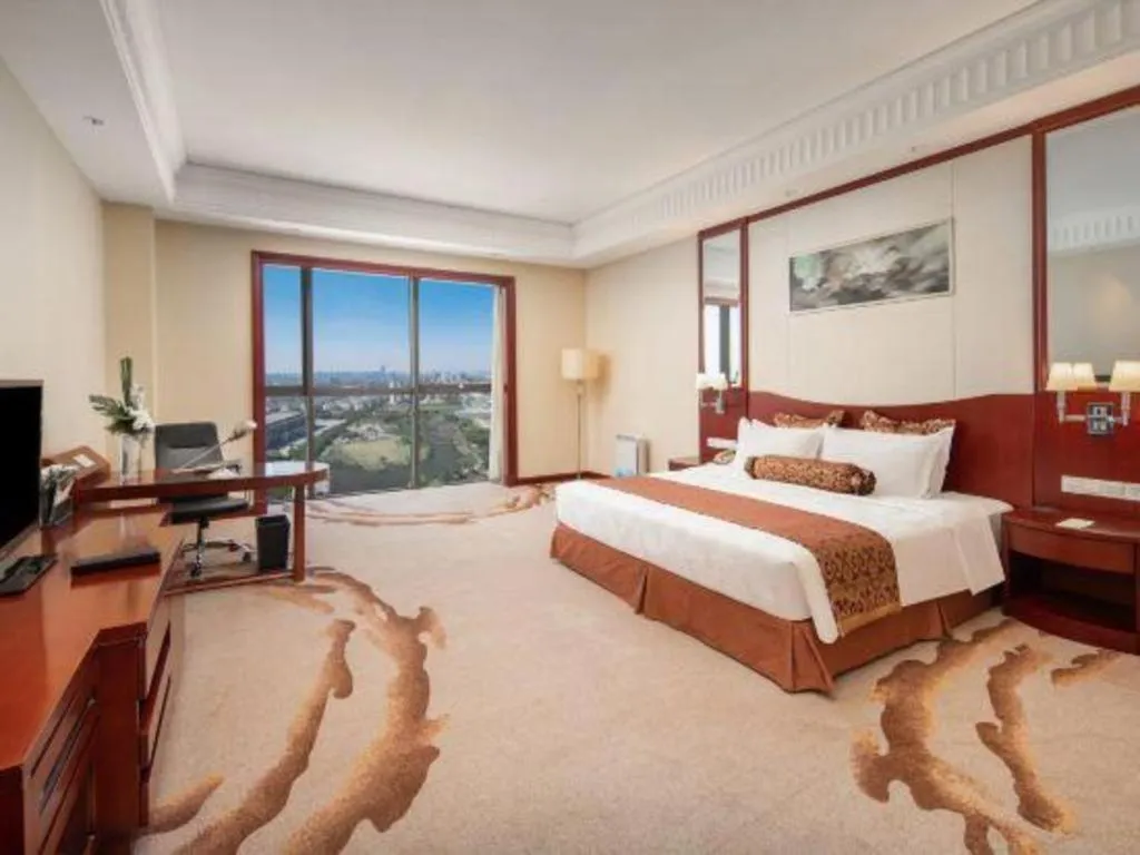 Bed in Longqi Jianguo Hotel Kunshan