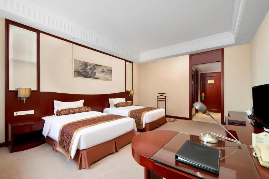 Bed in Longqi Jianguo Hotel Kunshan