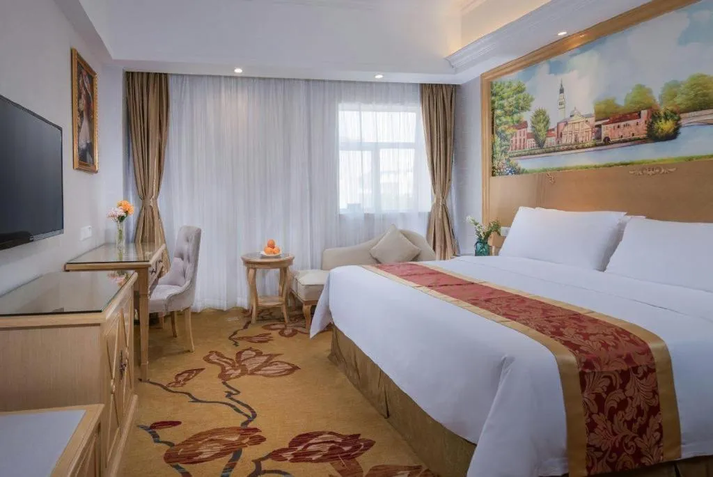 Bed in Vienna Hotel Shenzhen Longgang Baifucheng