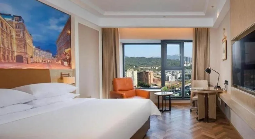 Bed in Vienna Hotel Shenzhen Longgang Baifucheng