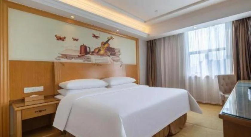 Bed in Vienna Hotel Shenzhen Longgang Baifucheng