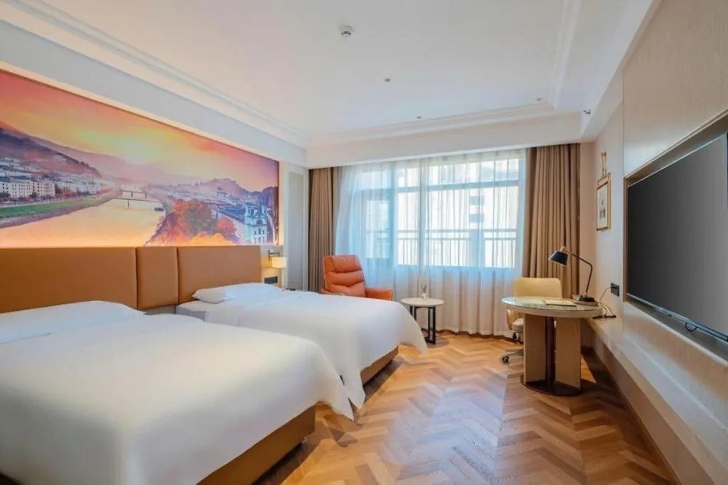 Bed in Vienna Hotel Shenzhen Longgang Baifucheng
