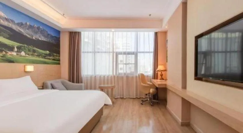 Bed in Vienna Hotel Shenzhen Longgang Baifucheng