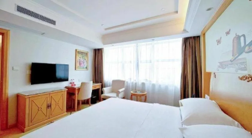 Bed in Vienna Hotel Shenzhen Longgang Baifucheng