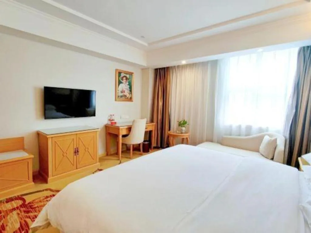 Bed in Vienna Hotel Shenzhen Longgang Baifucheng