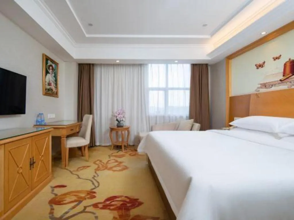 Bed in Vienna Hotel Shenzhen Longgang Baifucheng