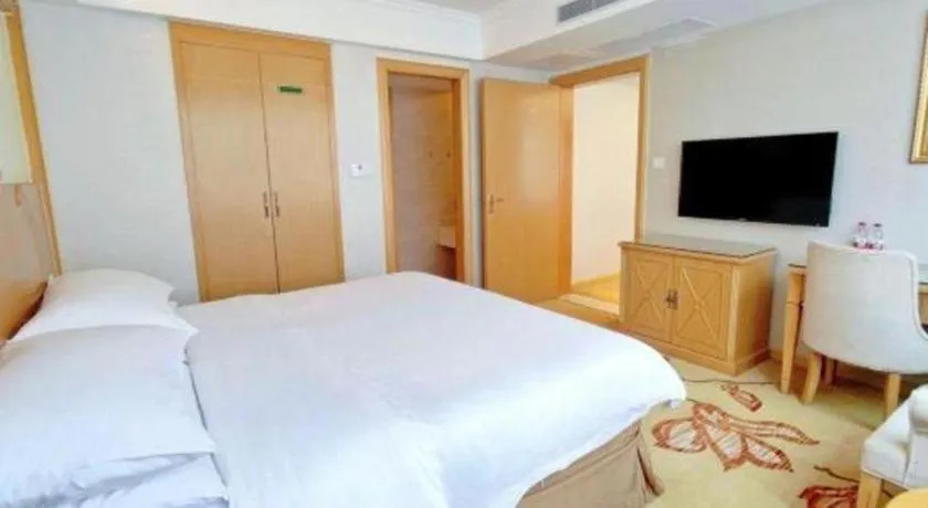 Bed in Vienna Hotel Shenzhen Longgang Baifucheng