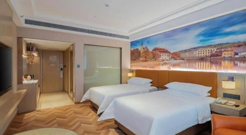 Bed in Vienna Hotel Shenzhen Longgang Baifucheng
