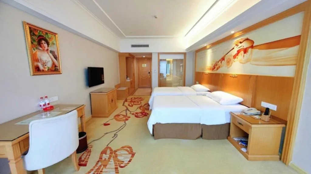 Bed in Vienna Hotel Shenzhen Longgang Baifucheng