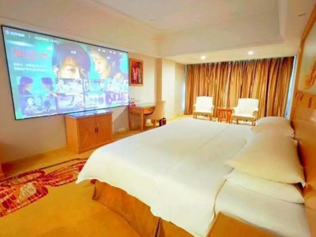 Bed in Vienna Hotel Shenzhen Longgang Baifucheng
