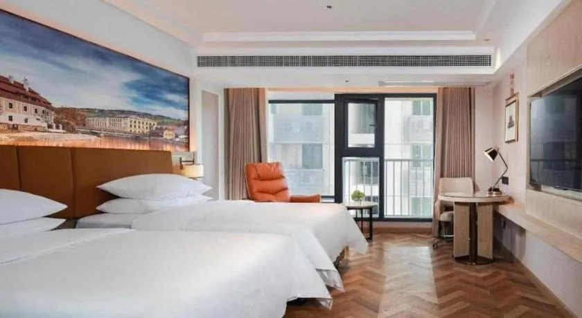 Bed in Vienna Hotel Shenzhen Longgang Baifucheng