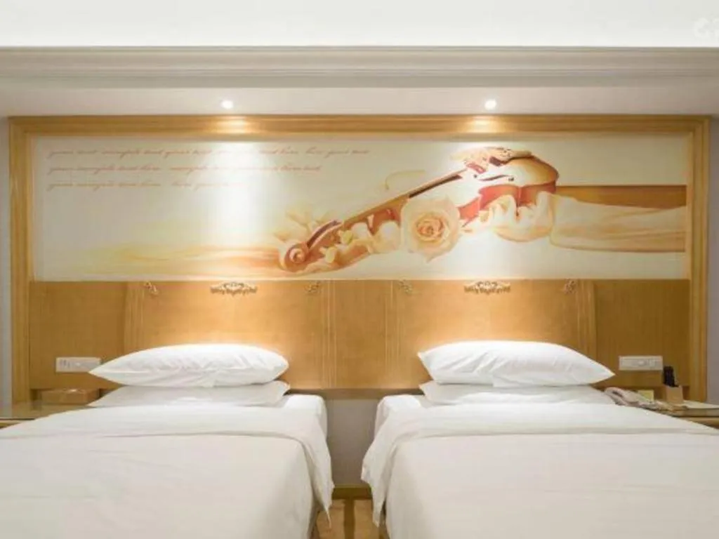 Bed in Vienna Hotel Shenzhen Longgang Baifucheng