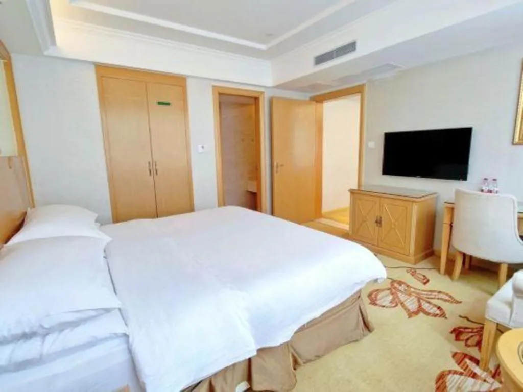 Bed in Vienna Hotel Shenzhen Longgang Baifucheng