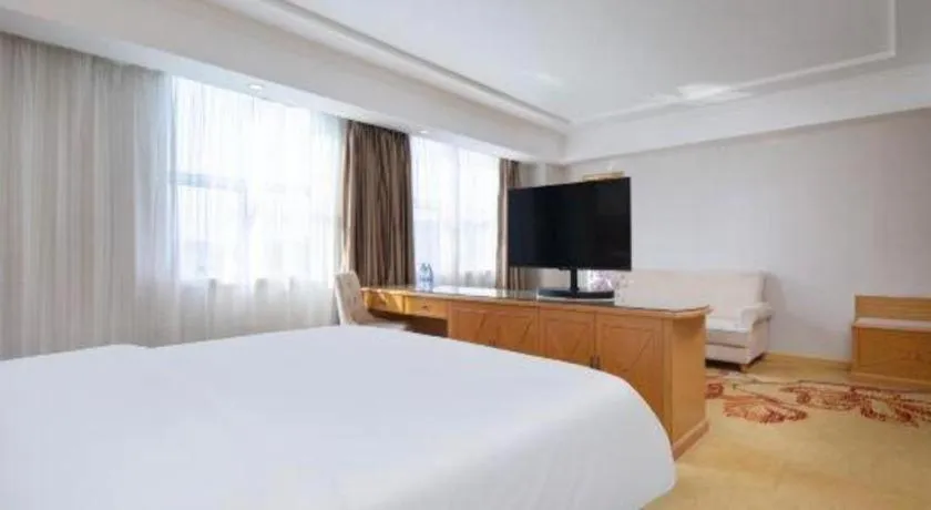 Bed in Vienna Hotel Shenzhen Longgang Baifucheng