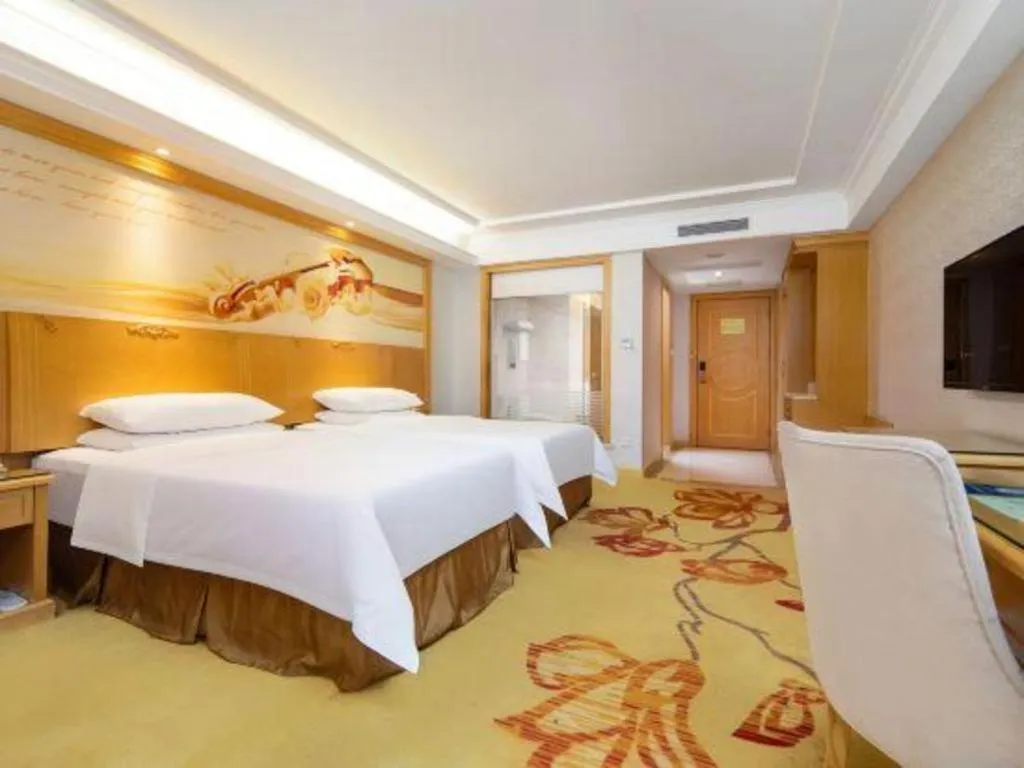 Bed in Vienna Hotel Shenzhen Longgang Baifucheng