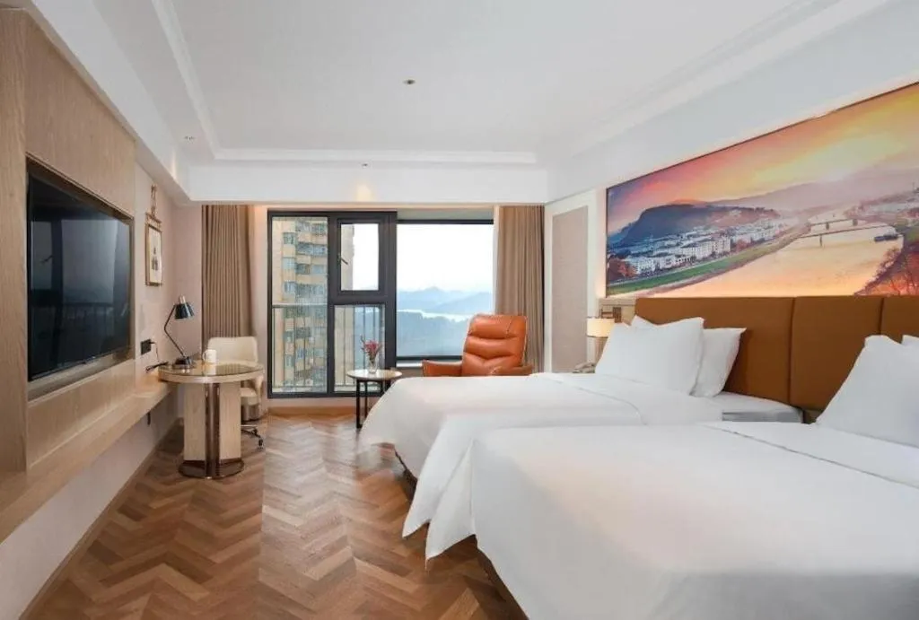 Bed in Vienna Hotel Shenzhen Longgang Baifucheng