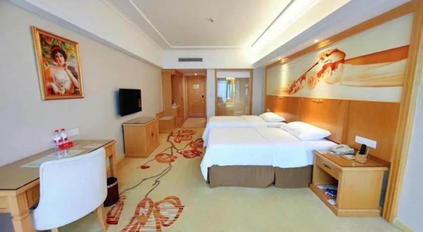 Bed in Vienna Hotel Shenzhen Longgang Baifucheng
